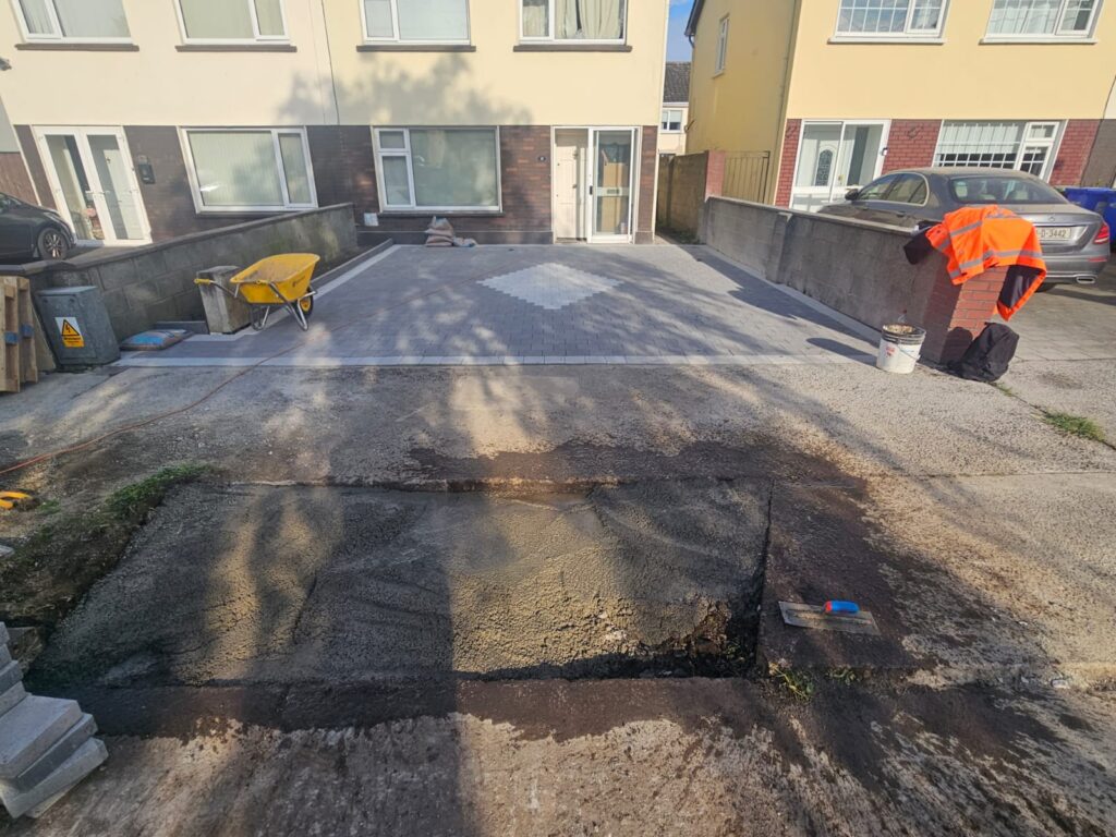 Driveway installation with black corrib and silver granite borders also with diamond silver granite in the centre piece