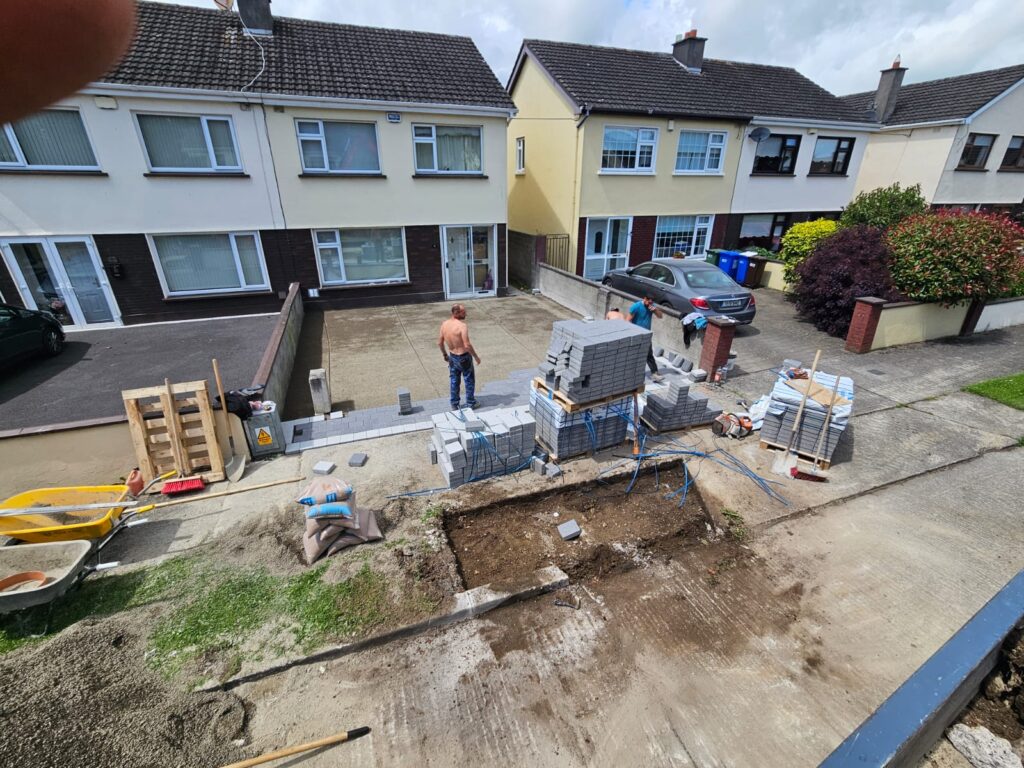 Extension of driveway with black corrib with silver granite borders also with diamond silver granite in the centre piece
