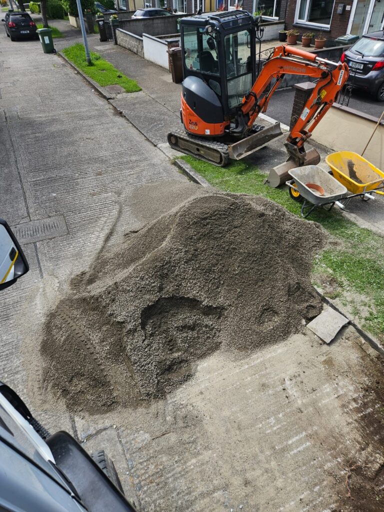 Extension of driveway with black corrib with silver granite borders also with diamond silver granite in the centre piece - Preparation