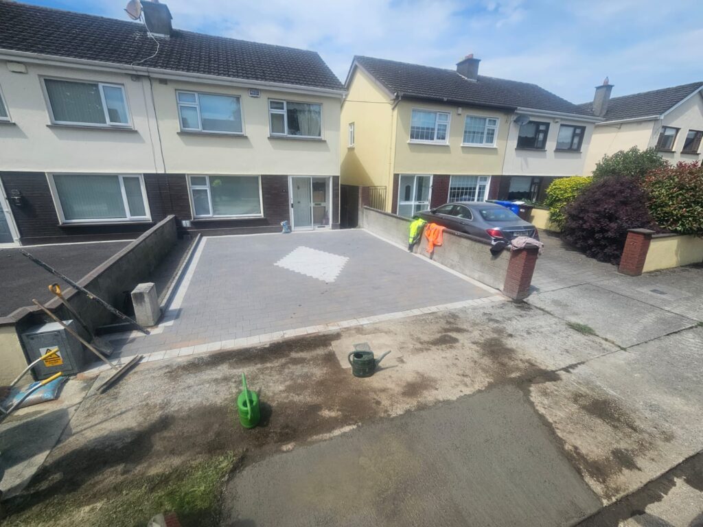 New driveway with black corrib with silver granite borders